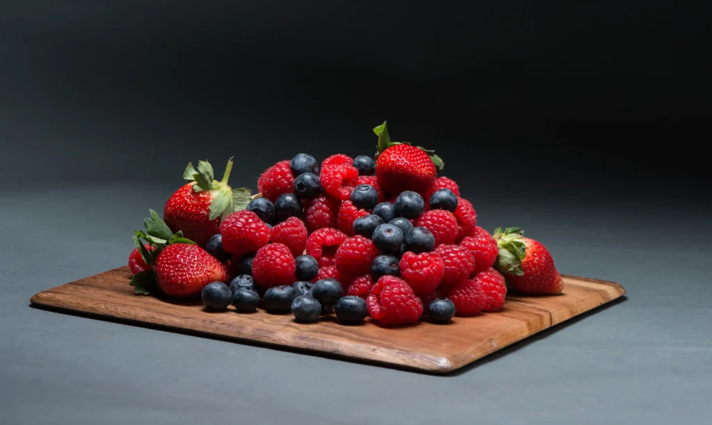 Mixed Berries On Wooden Board