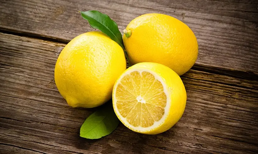 Lemons On Wooden Background